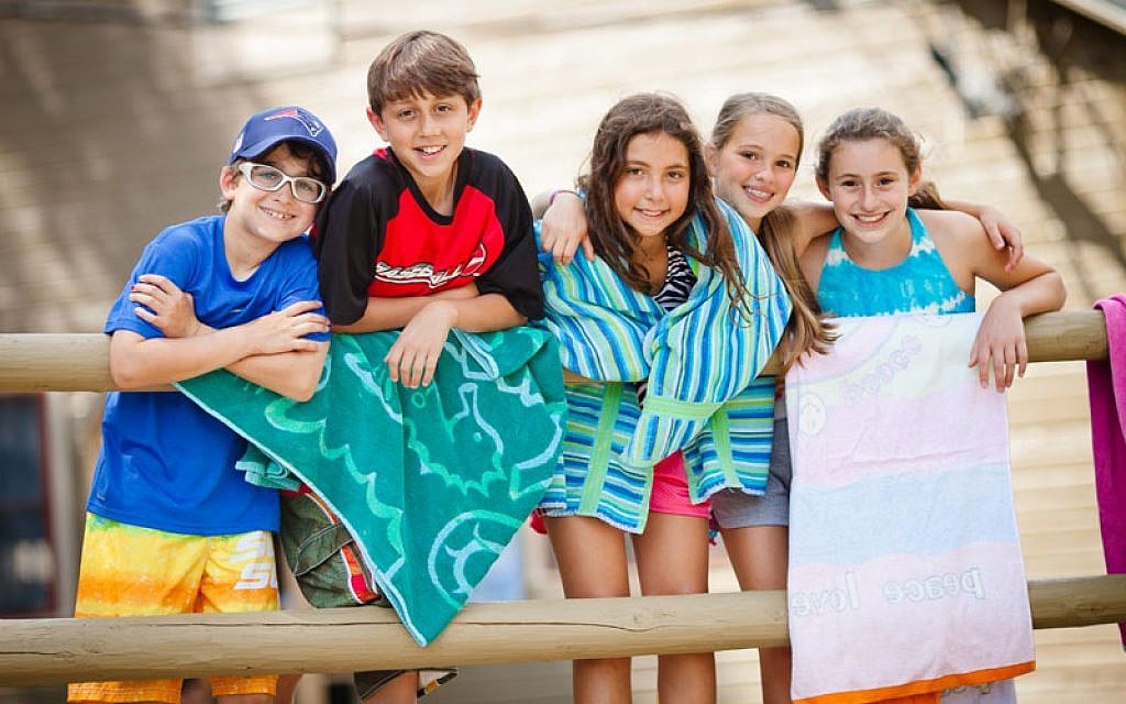 Illustrative photo of campers at Camp Ramah in New England get ready to cool down in the lake during a hot summer day. (photo credit: Nir Landau/Foundation for Jewish Camp via JTA)