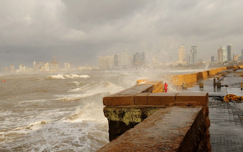 Waves crash against the Jaffa boardwalk as storm hits Israel (photo credit: Tomer Neuberg/Flash90)