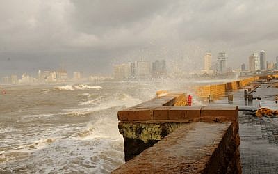Waves crash against the Jaffa boardwalk as storm hits Israel (photo credit: Tomer Neuberg/Flash90)