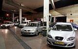 Motorists line up at a Jerusalem gas station before a price increase (photo credit: Nati Shohat/Flash 90)