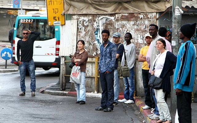 Tel Aviv residents wait for the bus (photo credit: Nicky Kelvin/Flash90)