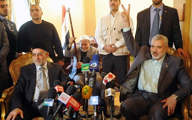 Egypt's Muslim Brotherhood leader Mohammed Badie (left) at a recent news conference with Palestinian Authority Prime Minister Ismail Haniyeh (photo credit: Mohammed El- Ostaz/POOL/ Flash90)