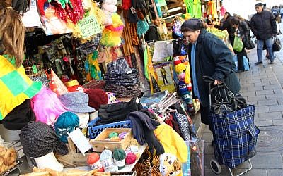 A woman checking out the costumes at the Mahaneh Yehuda market in Jerusalem (photo credit: Nati Shohat/Flash90)