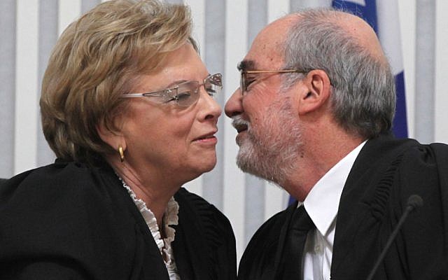Retiring head of the Supreme Court Dorit Beinish kisses Asher Grunis who was appointed to be her successor. (photo credit: Yossi Zamir/Flash90) Retiring head of the Supreme Court Dorit Beinish kisses Asher Grunis who was appointed to be her successor. (photo credit: Yossi Zamir/Flash90)