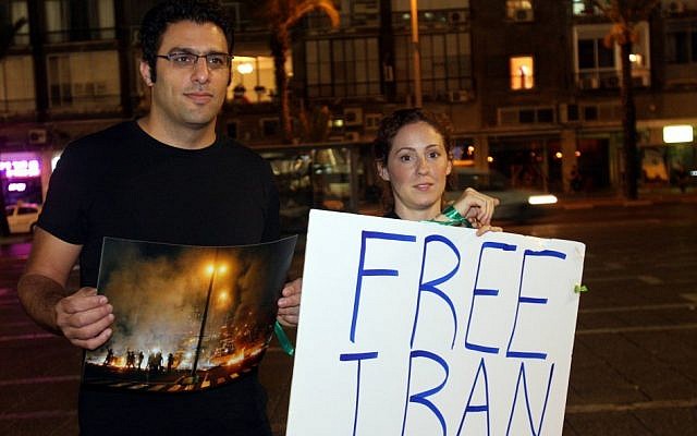 An Israeli woman takes part in a 2009 demonstration in Tel Aviv in support of Iranian opposition protesters (Photo by Roni Schutzer/Flash90)