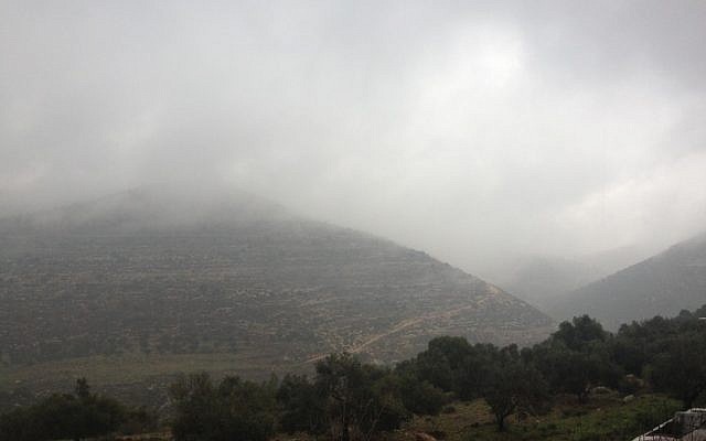 Clouds rolling through the hills outside Jerusalem Thursday (photo credit: Joshua Davidovic /Times of Israel)