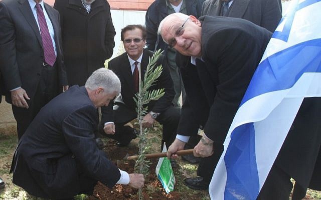 Knesset Speaker Reuven Rivlin (right) on Wednesday planted a young tree in a Jerusalem forest on the occasion of the Jewish holiday of Tu BiShvat (photo credit: Yossi Zamir/Flash90)