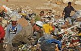 Trash collectors work at a dump outside Jerusalem (Photo credit: Kobi Gideon / Flash90)