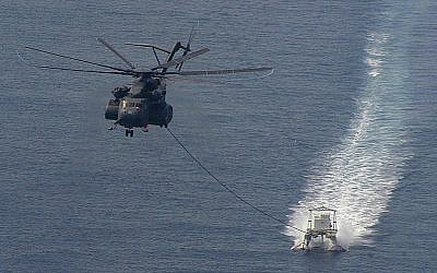 A US helicopter towing a minesweeper in the Persian Gulf in 2006. (photo credit: CC-BY-SA, Marion Doss, Flickr) A US helicopter towing a minesweeper in the Persian Gulf in 2006. (photo credit: CC-BY-SA, Marion Doss, Flickr)