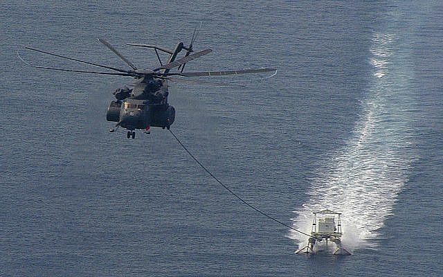 A US helicopter towing a minesweeper in the Persian Gulf in 2006. (photo credit: CC-BY-SA, Marion Doss, Flickr) A US helicopter towing a minesweeper in the Persian Gulf in 2006. (photo credit: CC-BY-SA, Marion Doss, Flickr)
