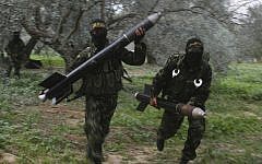 Illustrative: An undated photo of Islamic Jihad members in Gaza preparing to launch rockets toward Israel. (CC BY-SA Amir Farshad Ebrahimi, Flickr)