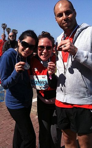 From left: Emma Datny, Michal Shmulovich, and Amer Dacca, after completing the 10K race at the Tel Aviv Marathon Friday (photo credit: courtesy) From left: Emma Datny, Michal Shmulovich, and Amer Dacca, after completing the 10K race at the Tel Aviv Marathon Friday (photo credit: courtesy)