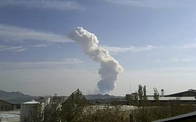 In this image taken from amateur video, smokes rises from an explosion at a Revolutionary Guard ammunition depot outside Bidganeh village, west of Tehran, last November (photo credit: AP)