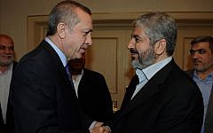 Then Turkish Prime Minister Recep Tayyip Erdogan meets with Hamas leader Khaled Mashaal in 2012. (Yasin Bulbul/AP)