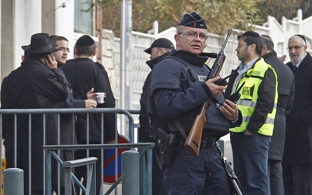 Soldiers outside the Otzar Hatorah school the day after a gunman opened fire in March 2012, killing four people in Toulouse, southwestern France. (photo credit: AP/Remy de la Mauviniere)