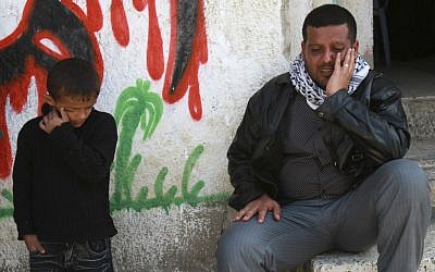 Palestinians mourning in Gaza on Saturday (photo credit: AP/Adel Hana)