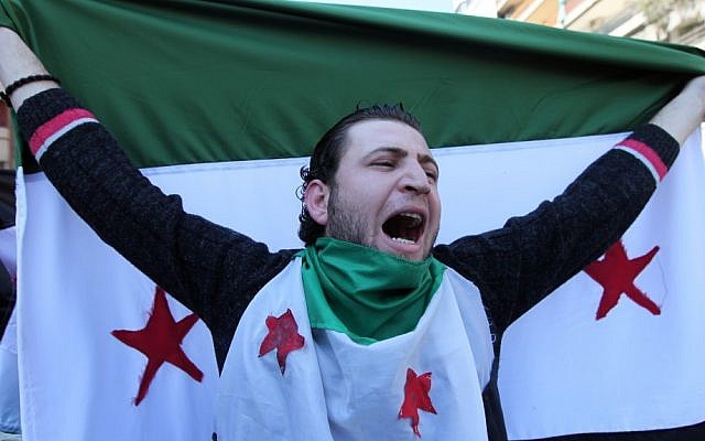 An anti-regime protester chants slogans against Syrian President Bashar Assad during a demonstration after Friday prayers in Beirut, Lebanon, March 23, 2012. (photo credit: AP Photo/Bilal Hussein)
