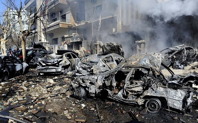 Burnt and destroyed cars are seen near the aviation intelligence department, which was attacked by one of two explosions in Damascus, Syria, March 17, 2012. (photo credit: AP Photo/SANA) Burnt and destroyed cars are seen near the aviation intelligence department, which was attacked by one of two explosions in Damascus, Syria, March 17, 2012. (photo credit: AP Photo/SANA)