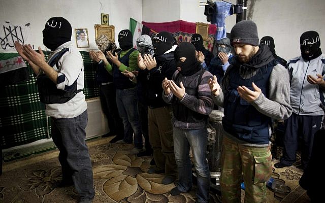 Free Syrian Army fighters pray in Idlib, north Syria, on Thursday (photo credit: AP Photo/Rodrigo Abd) Free Syrian Army fighters pray in Idlib, north Syria, on Thursday (photo credit: AP Photo/Rodrigo Abd)