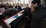 The funeral of Damascus bombing victims Sunday (photo credit: AP/Muzaffar Salman)