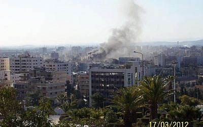 Smoke rises from the site of a bombing in Damascus on Saturday morning. (photo credit: @zaidbenjamin, Twitter)