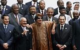Libyan leader Muammar Gaddafi, center, flanked on his right by Egyptian President Hosni Mubarak, and on his left by Yemeni President Ali Abdullah Saleh, with Tunisian President Zine El Abidine Ben Ali on the far left, posing during the second Afro-Arab summit in Sirte, Libya, in 2010 (photo credit: AP/Amr Nabil)