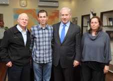 Gilad Shalit and his parents with Prime Minister Benjamin Netanyahu in Tel Aviv on Thursday (photo credit: GPO)
