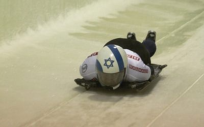 Skeleton competitor Bradley Chalupski, representing Israel, starts down the track at the men's world championships in Lake Placid, NY, February 24, 2012. (Photo credit: Ken Childs/JTA)
