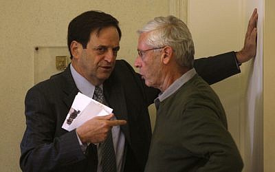 Deputy Prime Minister Dan Meridor (left) speaks with MK Benny Begin at the Prime Minister's Office in Jerusalem. (photo credit: Lior Mizrahi/Flash90)