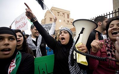 Palestinians protest during the annual Land Day march in Jaffo.  Land Day commemorates Israel's appropriation of Arab-owned land. (photo credit: Dima Vazinovich/Flash90)