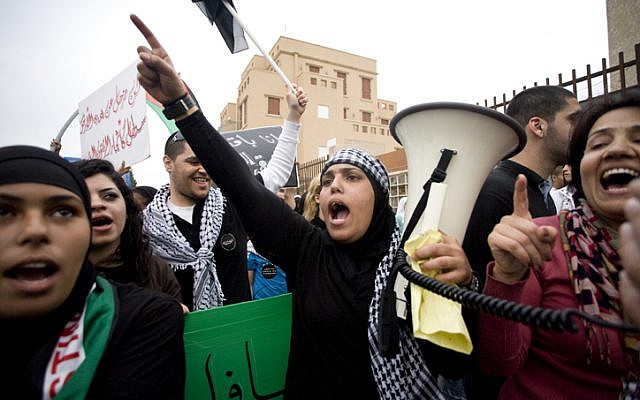 Palestinians protest during the annual Land Day march in Jaffo. Land Day commemorates Israel's appropriation of Arab-owned land. (photo credit: Dima Vazinovich/Flash90) Palestinians protest during the annual Land Day march in Jaffo. Land Day commemorates Israel's appropriation of Arab-owned land. (photo credit: Dima Vazinovich/Flash90)