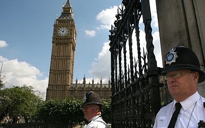 English policemen guard Big Ben and the Houses of Parliament in London (photo credit: Yossi Zamir/Flash90)