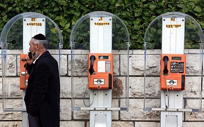 An Orthodox Jew on the telephone in Israel. (Nati Shohat/ Flash90)