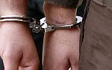 Illustrative. A man's hands in handcuffs. (Olivier Fitoussi/Flash90)