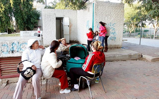 Israelis sit near a bomb shelter in the southern city of Netivot during operation Cast Lead in December 2008 (photo credit: Roni Schutze/Flash 90) Israelis sit near a bomb shelter in the southern city of Netivot during operation Cast Lead in December 2008 (photo credit: Roni Schutze/Flash 90)