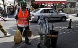 An ultra-Orthodox Israeli works as a street cleaner. A new study says more ultra-Orthodox men are joining the workforce (photo credit: Serge Attal/Flash 90)
