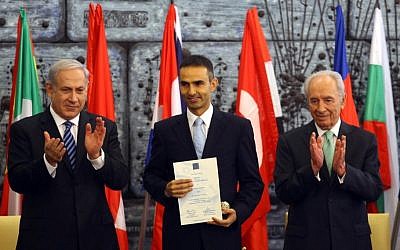 Better times ahead? Prime Minister Benjamin Netanyahu and President Shimon Peres thank a Turkish representative of the firefighting team that helped Israel douse the Carmel forest fire in December 2010 (photo credit: Abir Sultan/Flash90)
