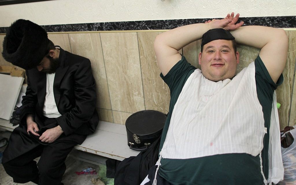 Drunk at shul when it's a traditional obligation -- on Purim. (illustrative photo credit: Nati Shohat/FLASH90)