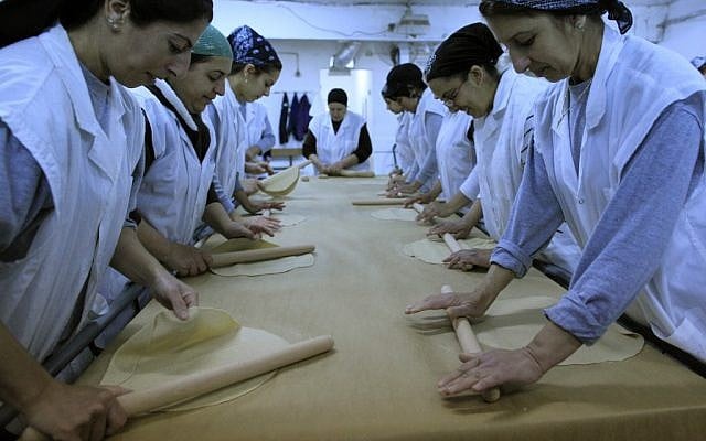 Women working in a matza factory (photo credit: Tsafrir Abayov/Flash90) Women working in a matza factory (photo credit: Tsafrir Abayov/Flash90)