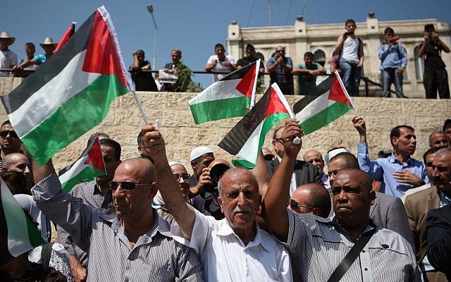 Palestinian protesters in Jerusalem (photo credit: Sliman Khadr/Flash90)