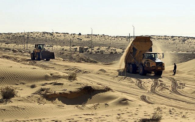 Construction on the new barrier along the Israeli-Egyptian border in March (photo credit: Tsafrir Abayov/Flash90) Construction on the new barrier along the Israeli-Egyptian border in March (photo credit: Tsafrir Abayov/Flash90)