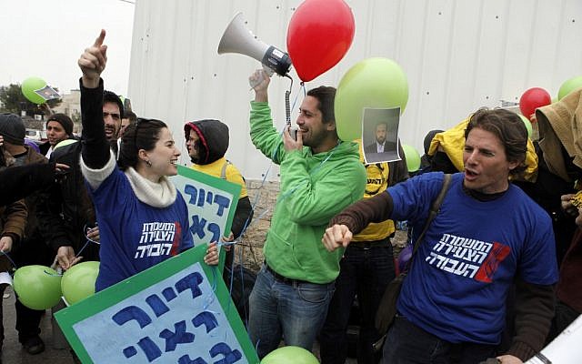 Students protest outside the Ministry of Construction in East Jerusalem against the government's housing policy (photo credit: Uri Lenz/Flash90)