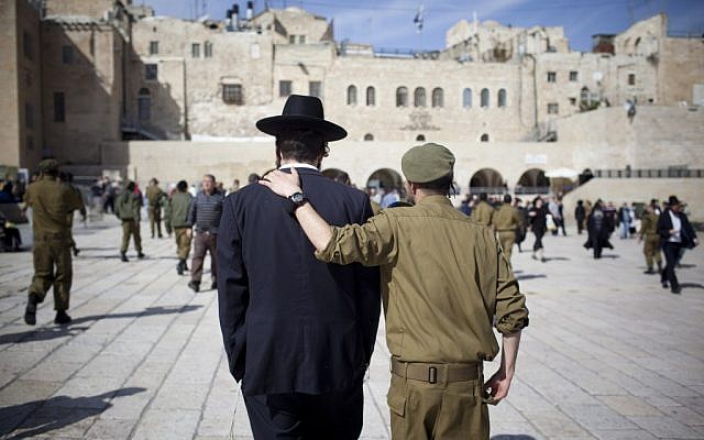 Soldier and ultra-Orthodox man, shoulder to shoulder (photo credit: Yonatan Sindel/Flash90)