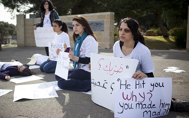 Jewish and Arab women silently protest domestic violence at Hebrew University in Jerusalem on March 8, International Women's Day (photo credit: Yonatan Sindel/Flash90) Jewish and Arab women silently protest domestic violence at Hebrew University in Jerusalem on March 8, International Women's Day (photo credit: Yonatan Sindel/Flash90)