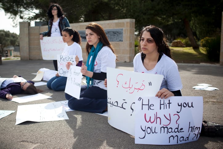 Jewish and Arab women silently protest domestic violence at Hebrew University in Jerusalem on March 8, 2012, International Women's Day (Yonatan Sindel/Flash90)