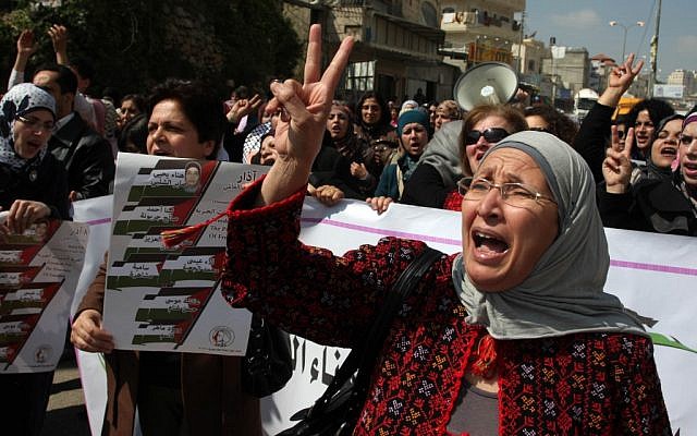 Palestinian women show their solidarity with female Palestinian hunger striker Hana Shalabi, at the Qalandia checkpoint near the West Bank city of Ramallah on March 08, 2012. (photo credit: Issam Rimawi/Flash90)