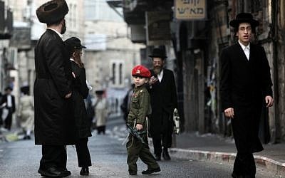 Israeli public opinion wants this ultra-Orthodox child dressed up for Purim to wear a similar uniform when he turns 18. (photo credit: Kobi Gideon/Flash90)