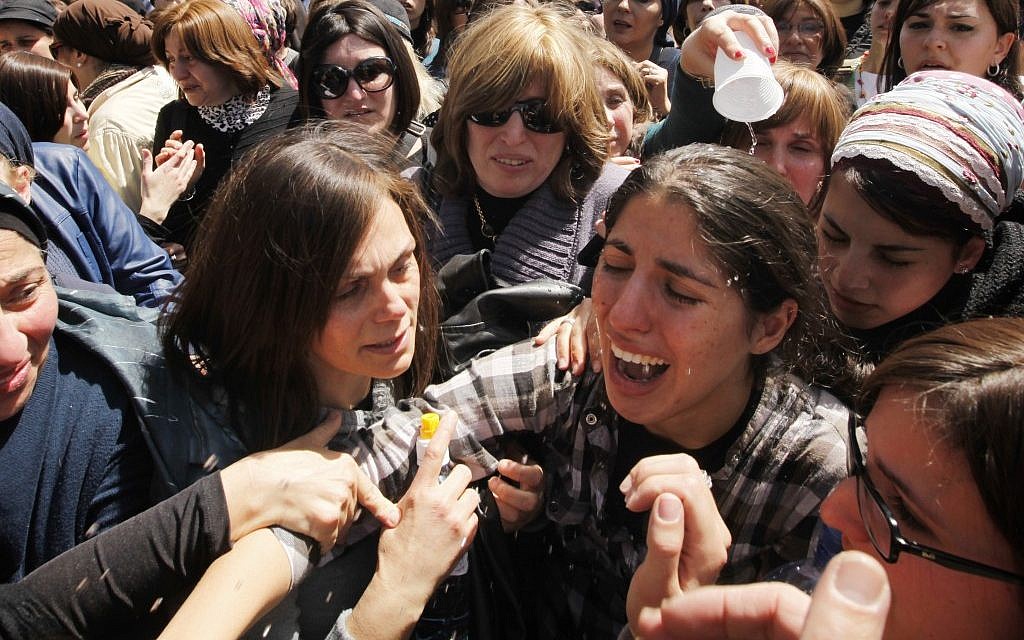 The sister of 8-year-old Miriam Monsonego cries at the Jerusalem funeral of Miriam and the three other Toulouse Jewish school shooting victims, March 2012. (photo credit: Miriam Alster/Flash90)
