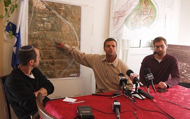 Haim Teitelbaum (left) and other Migron settlers hold a press conference on Monday. (photo credit: Flash90)