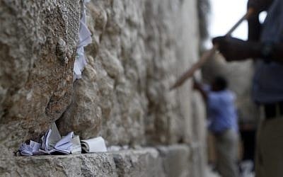 After removal, the thousands of notes are buried on the nearby Mount of Olives. (photo credit: Uri Lenz/Flash90)